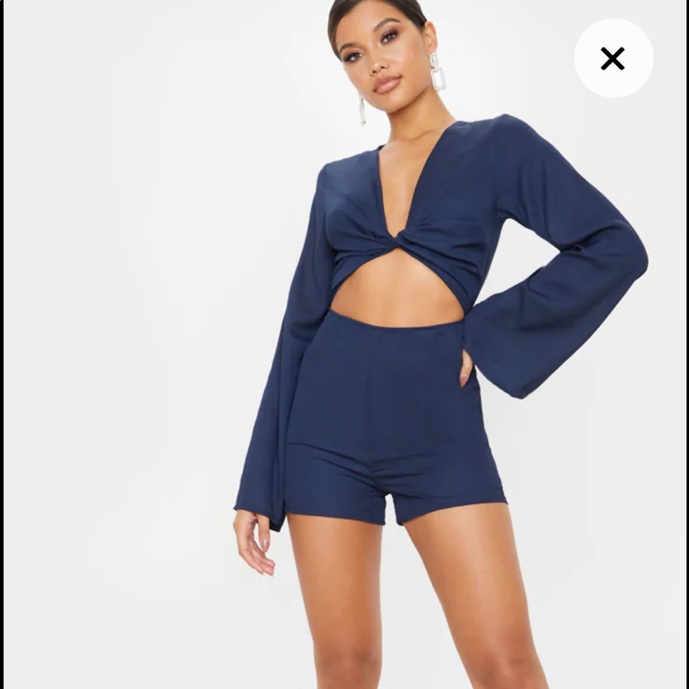NWOT Pretty Little Thing Navy Bell Sleeve Romper in size 6